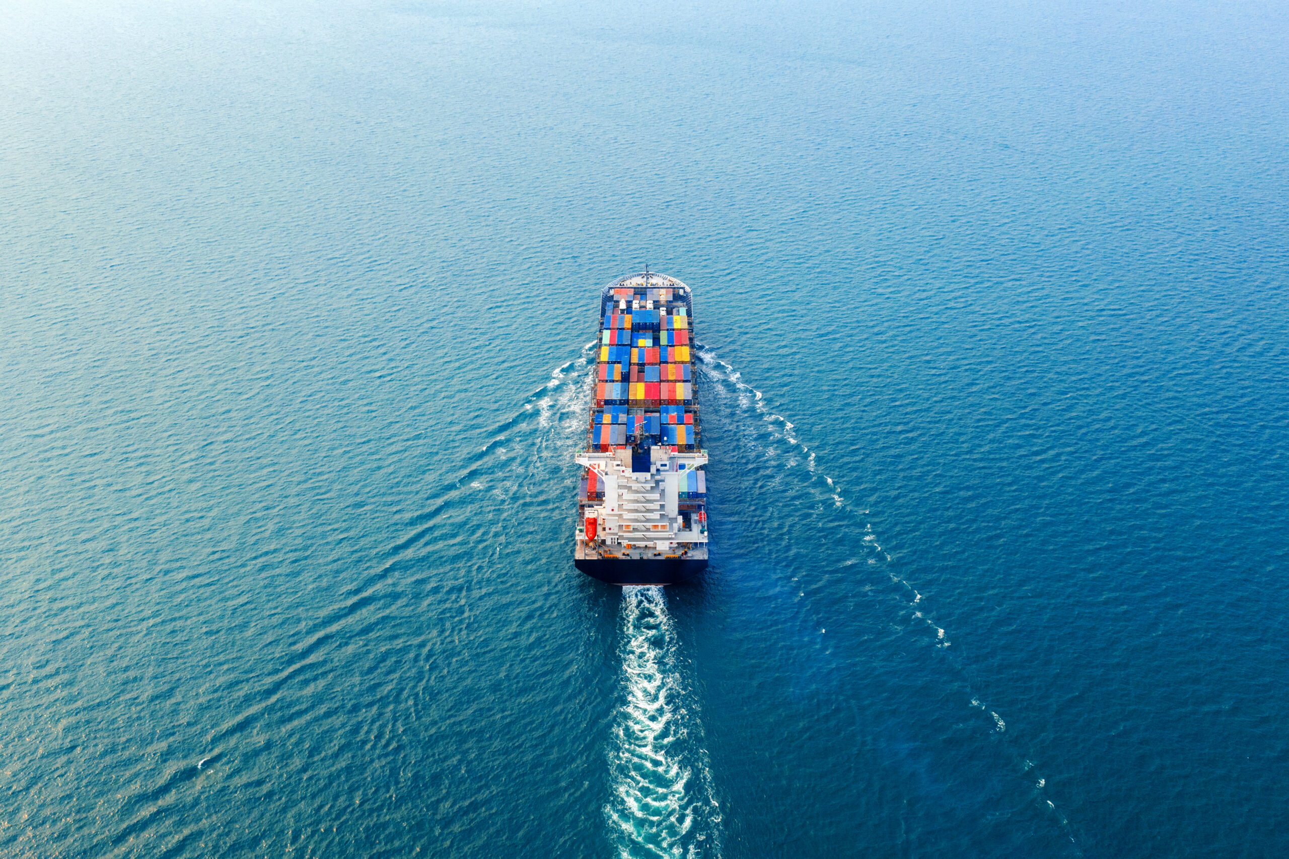 Aerial view of container cargo ship in sea. Aerial view of container cargo ship in sea.